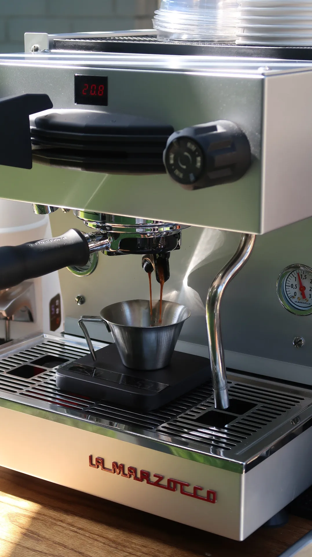 Barista pulling an espresso shot for a corporate office coffee catering event