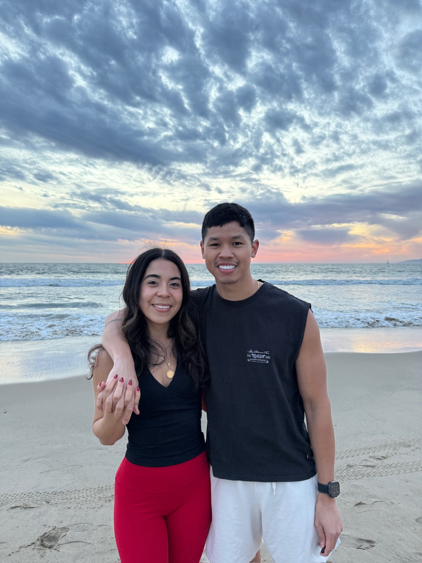 John and Ysabelle, founders of Redcart Coffee, on the beach